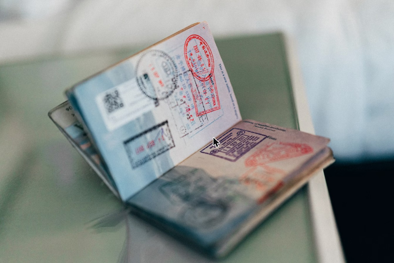 An open passport marked with stamps from many countries