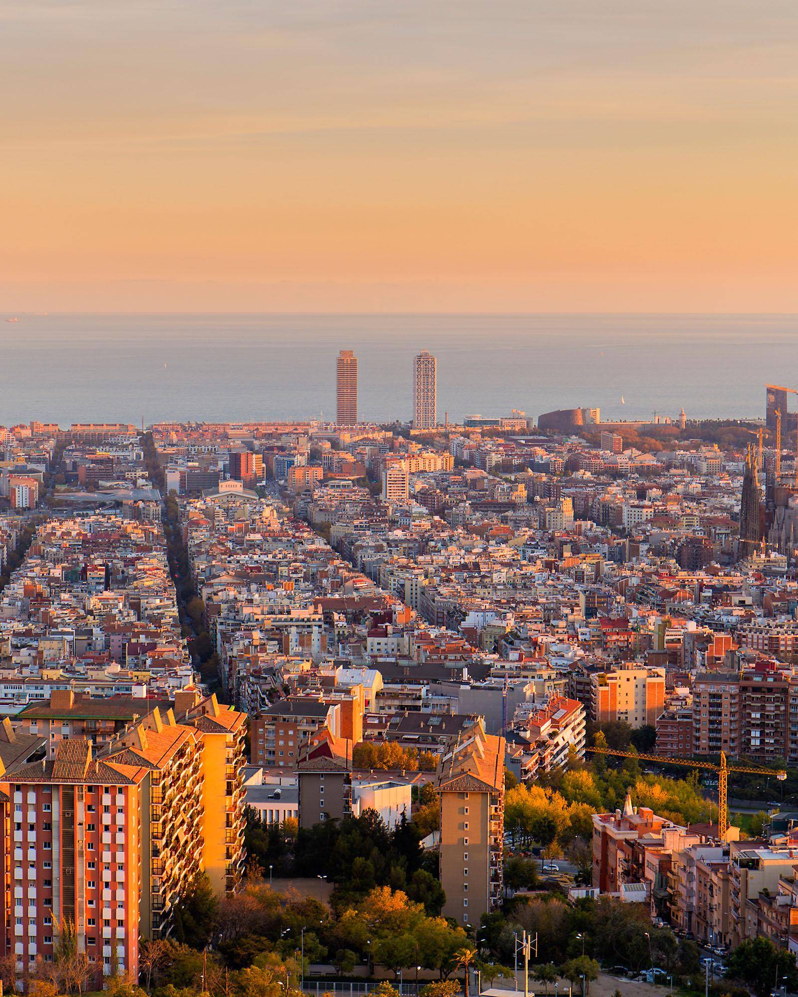 Rooftop terrace overlooking the Barcelona skyline at golden hour